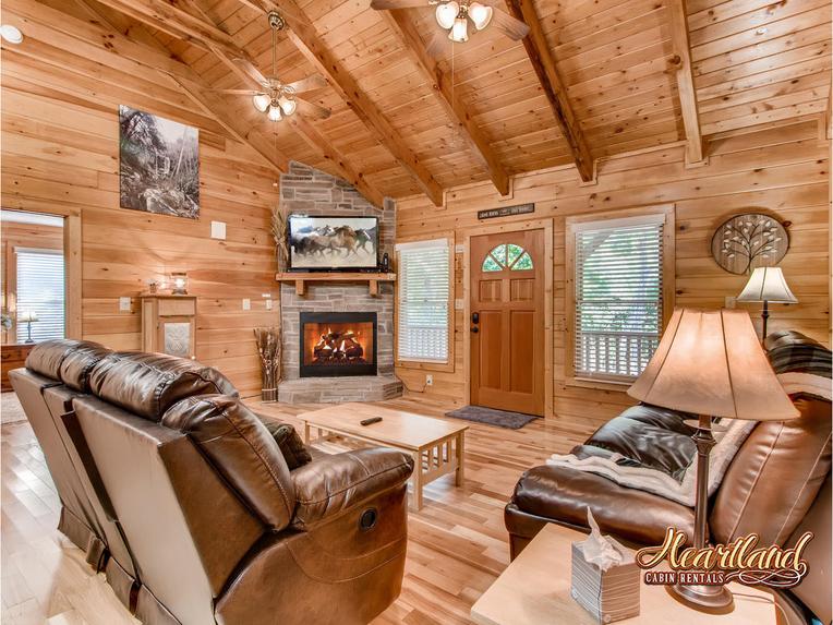 Spacious living room with gas fireplace and flat screen TV